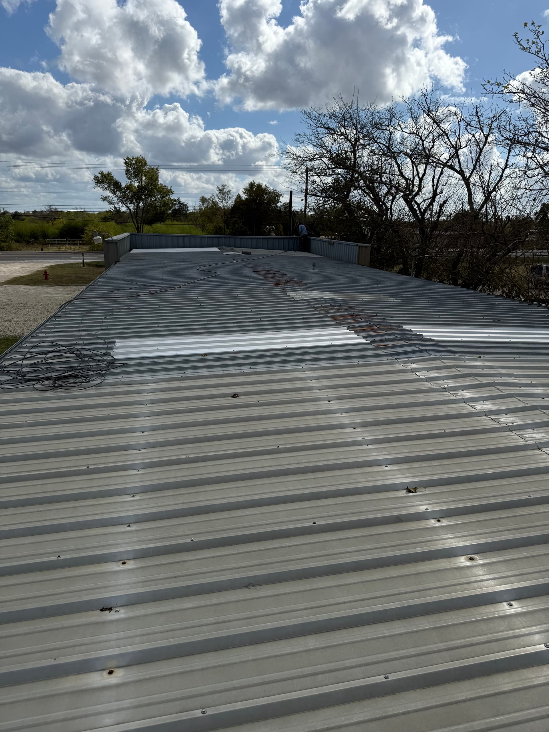 Reviving a Weathered Roof with Metal Restoration