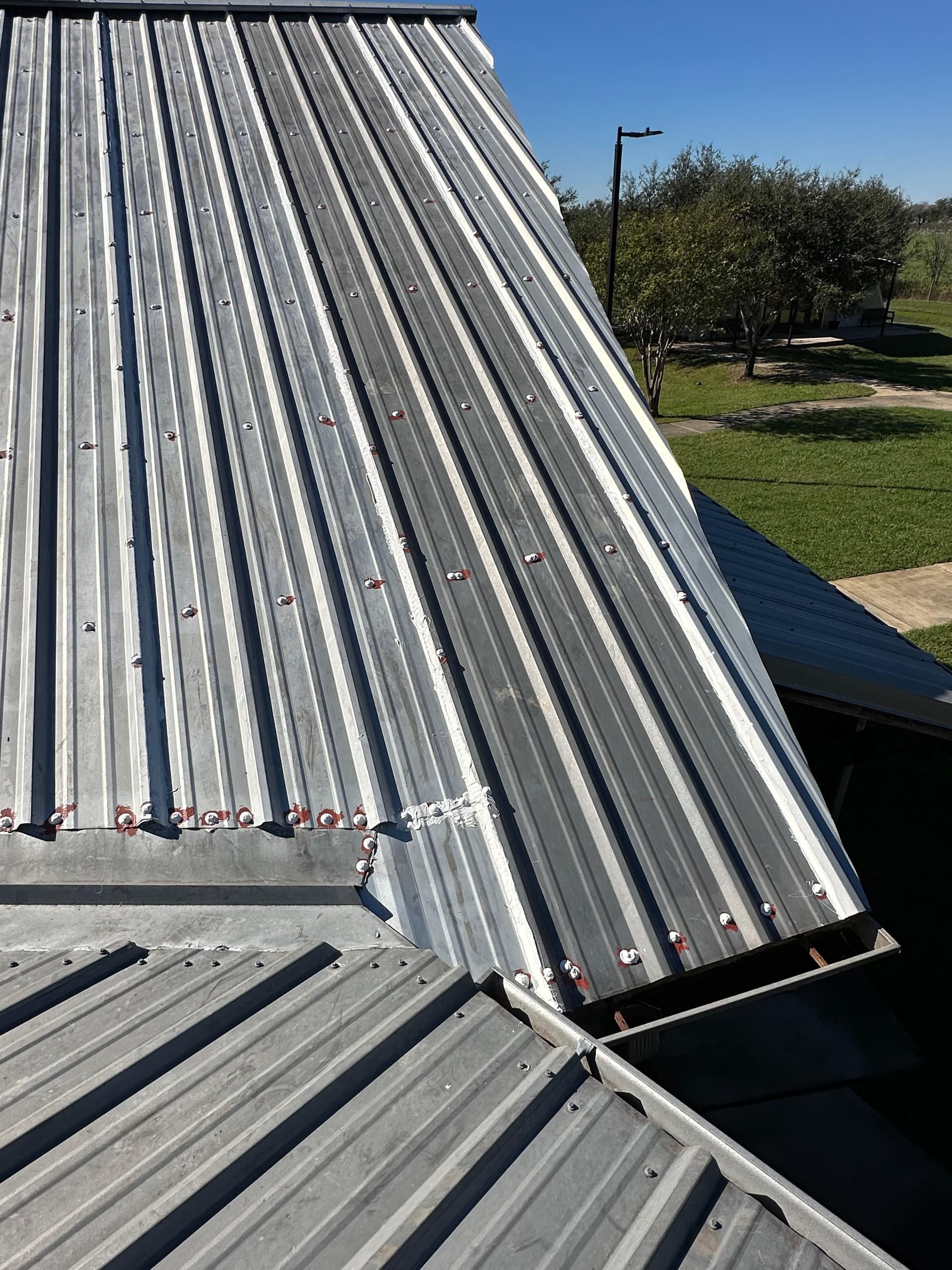 Metal Roof Maintenance with Seam Sealing and Skylight Care image